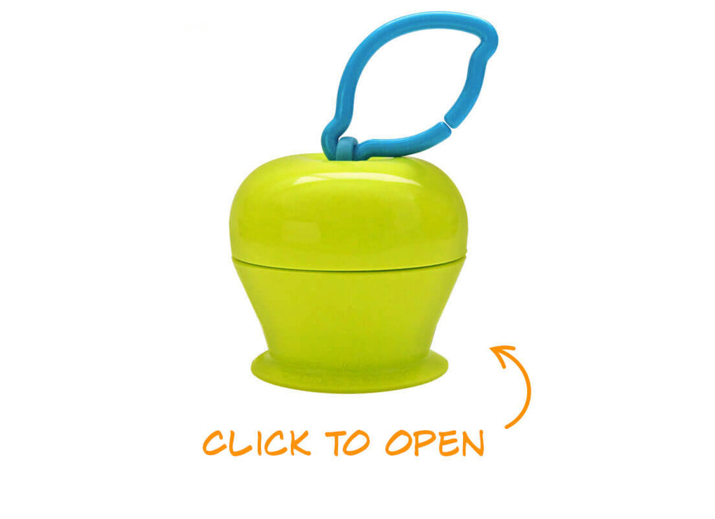 The Grapple® toy tether is a green, apple-shaped adjustable toy holder that suctions to any smooth surface and holds your baby’s favorite toys with silicone straps.